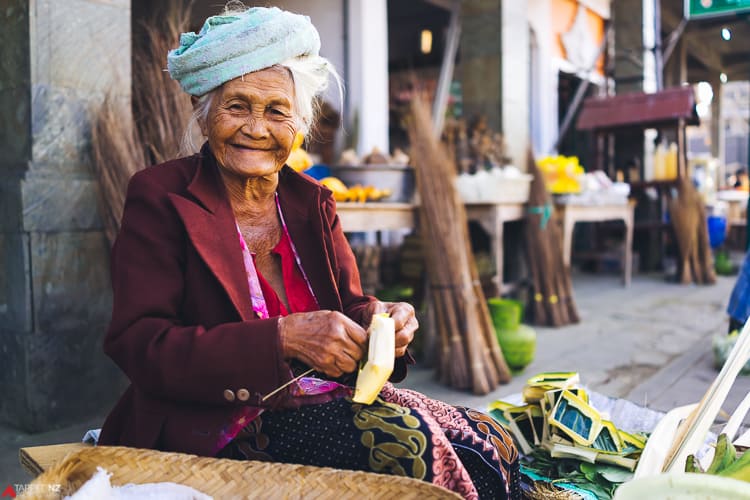 Indonesian lady weaving her daily offereing baskets. Shot on Sony RX1R