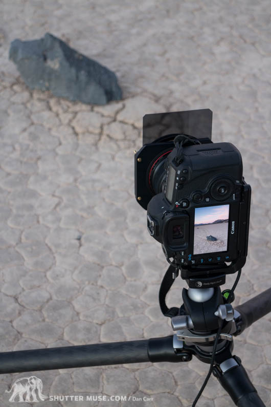 Photographing the mysterious traveling rocks of the Racetrack Playa with a filter holder and graduated ND filter.